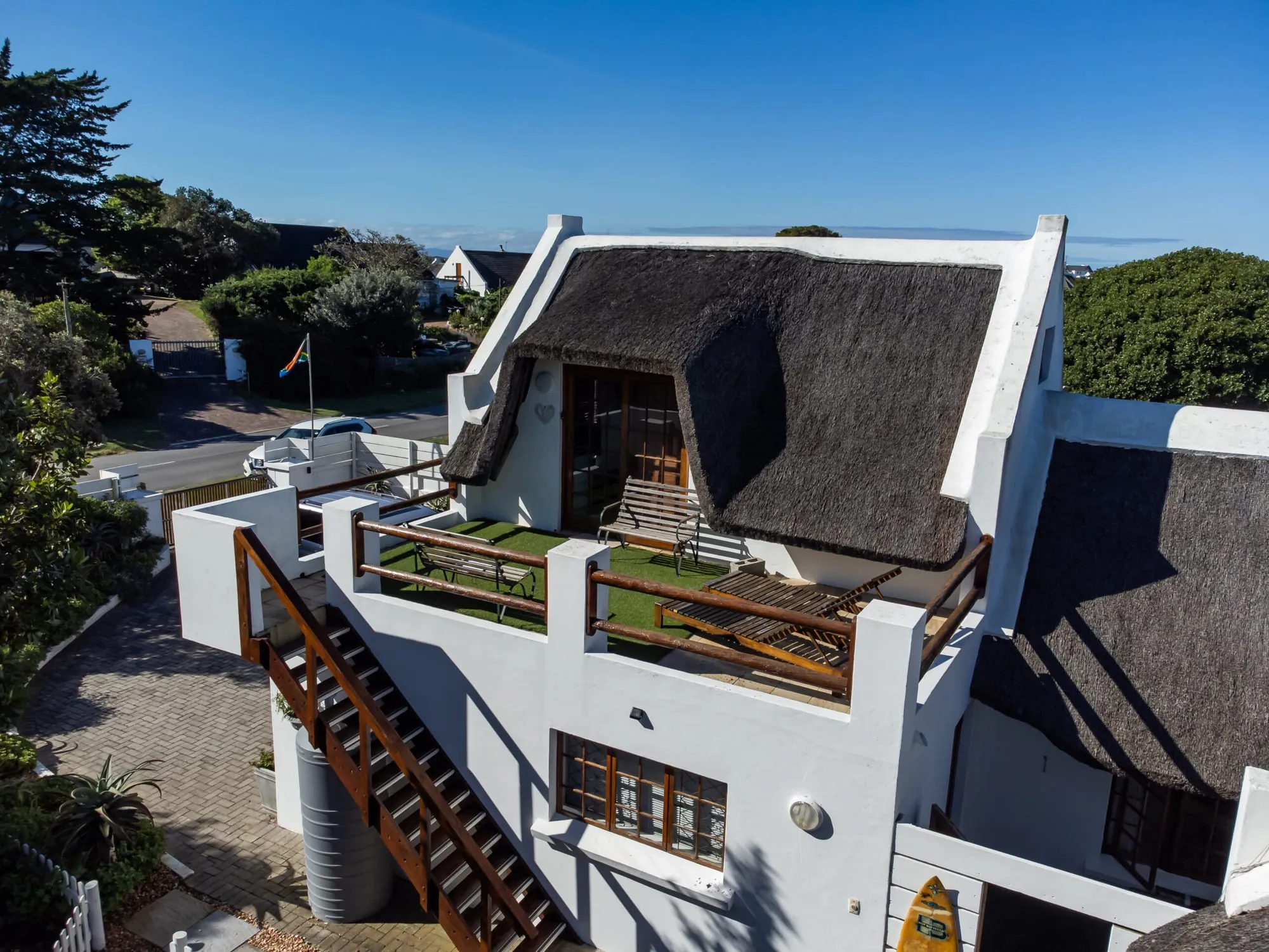 Berry Cottage from above, showing its upstairs entrance, staircase and private verandah
