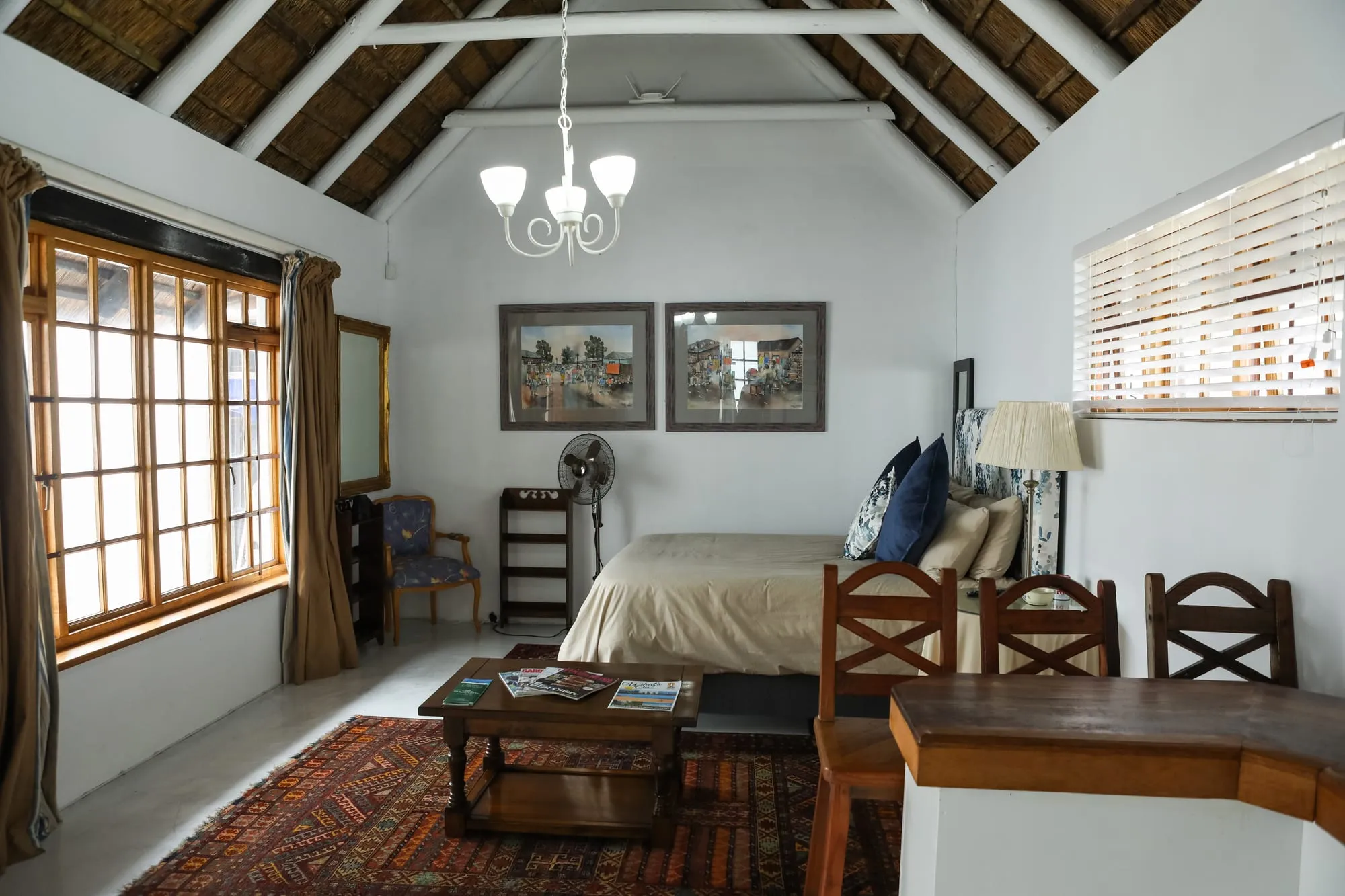 Milkwood Cottage's open-plan living and sleeping area beneath the vaulted thatch